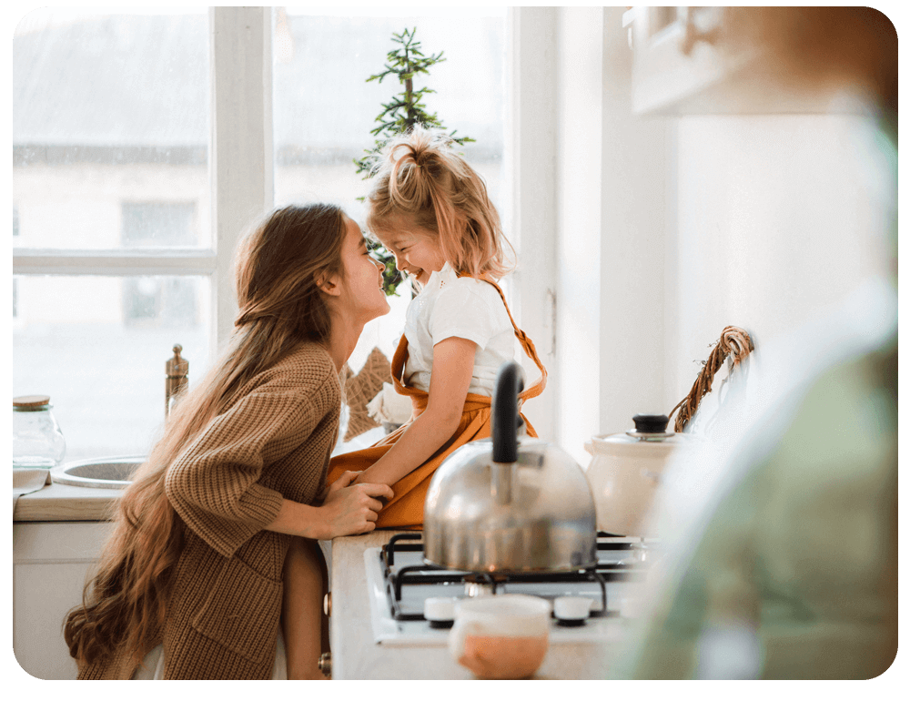 A woman is playing with her daughter in the kitchen in Austin and Dallas, TX