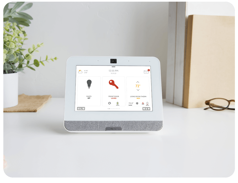 Homeowner using an Alert 360 security panel at home