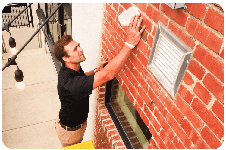 Business operator checking a security camera feed