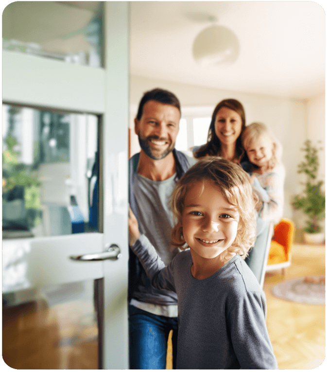Family at the front door with an Alert 360 smart video doorbell camera