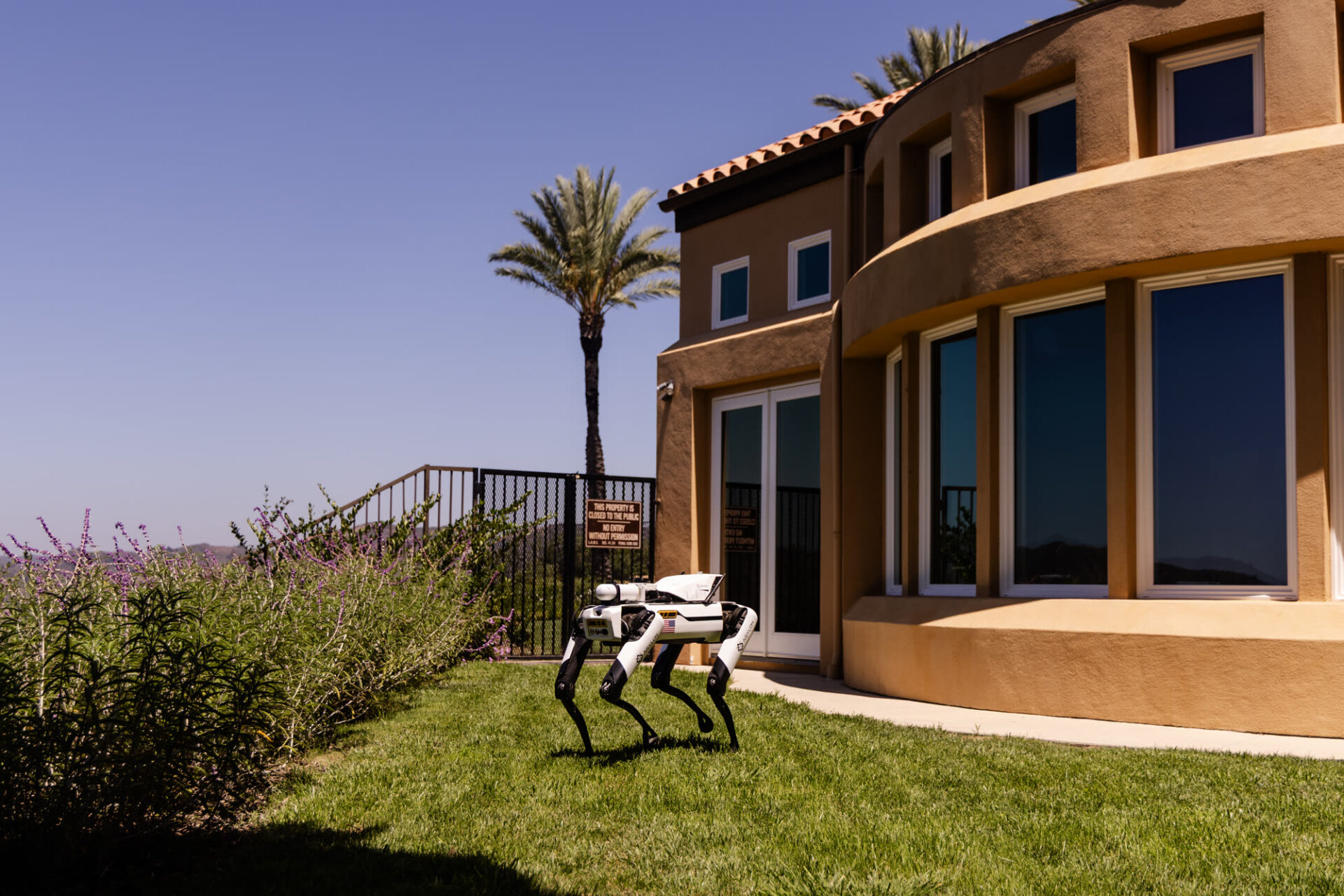 DroneDog robot returning to its DogHouse charging dock