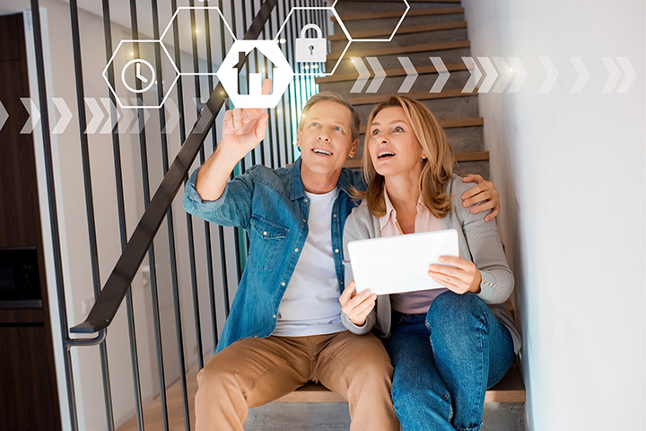 Happy couple using AI in home security